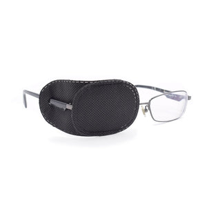 Black eye patch over the right lens of a pair of glasses on white background.