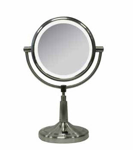 Round, illuminated mirror face on silver stand with circular base against a white background.